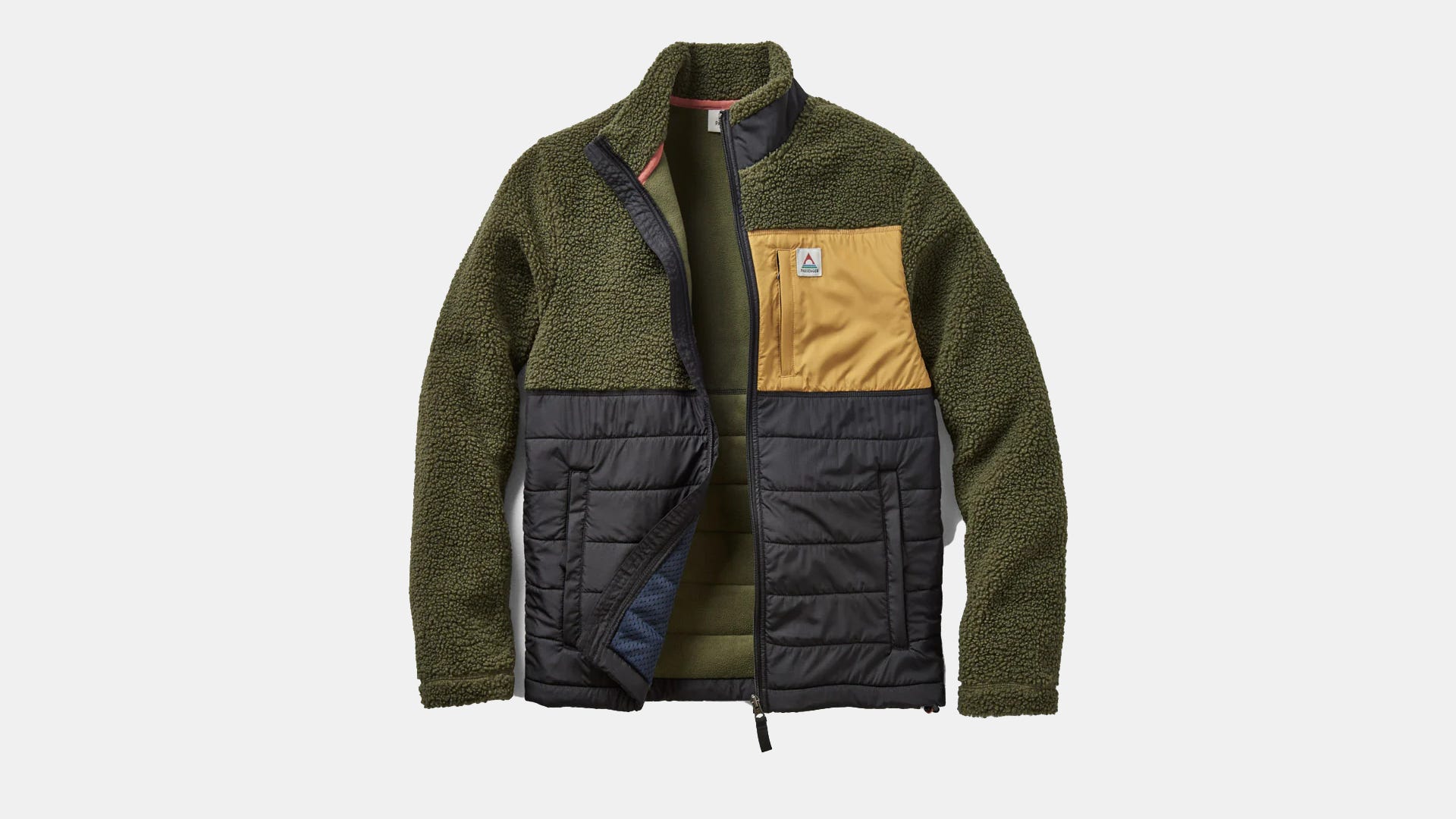 A green and yellow comfy sweater on a gray background.
