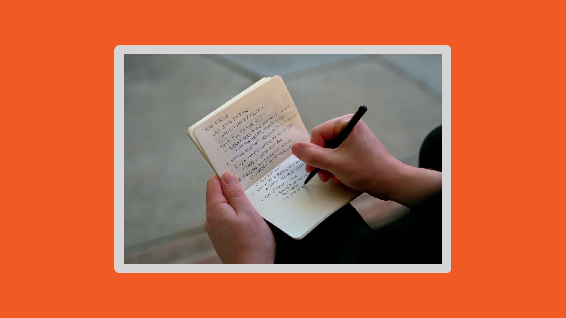 Single frame of person writing in a notebook on an orange background.