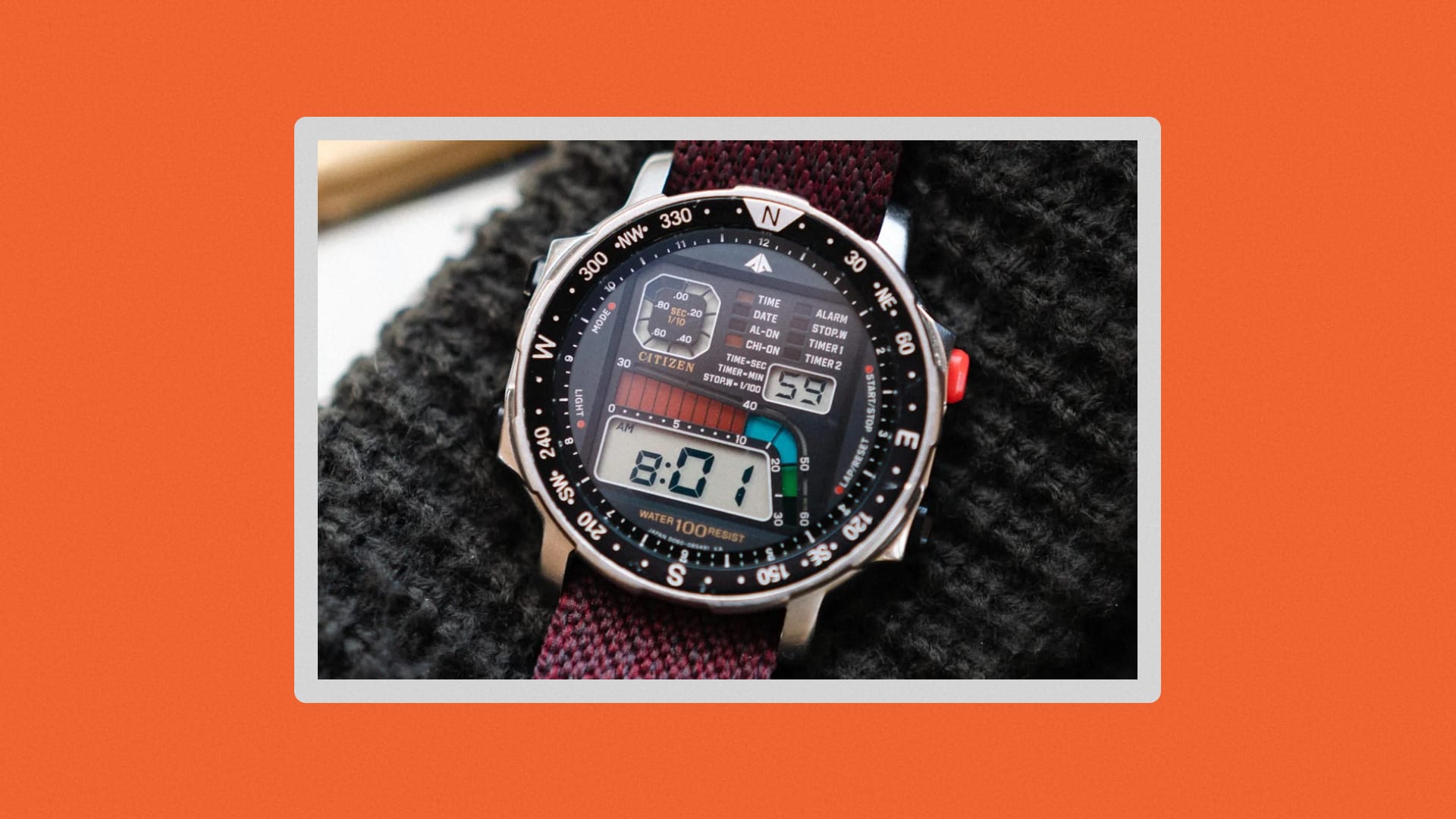 Citizen digital watch resting on a wool hat. \