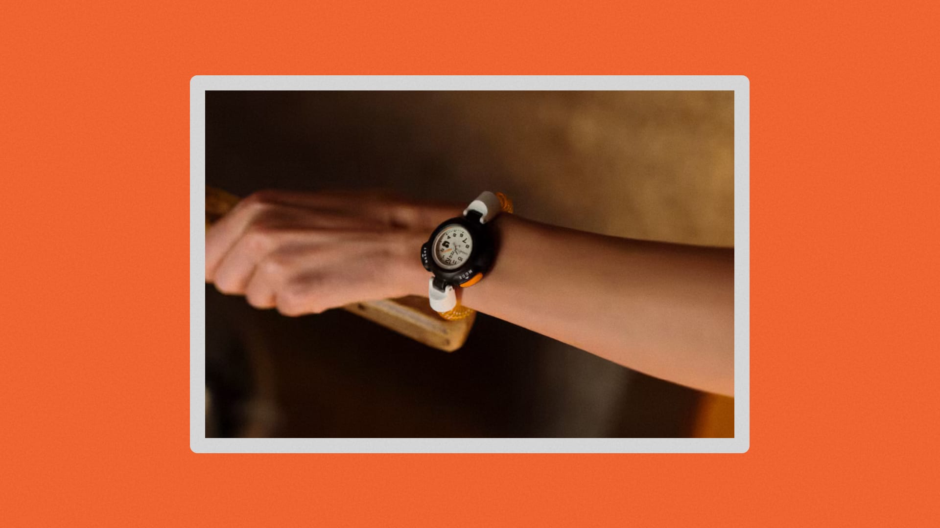 Close-up of watch on wrist of someone in a sauna.