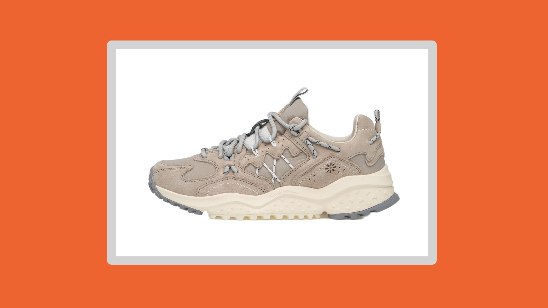 Grey/beige sneaker on a white background.