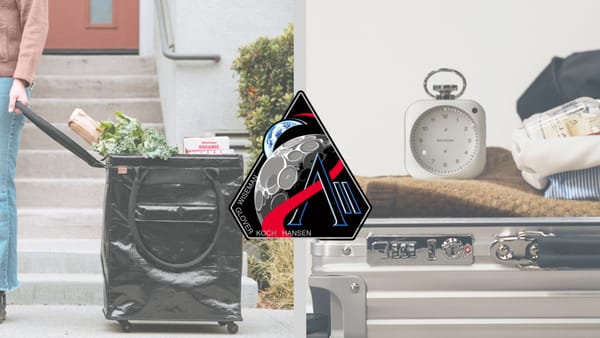 Rollable tote filled with groceries on the left, the Artemis II mission patch in the center, and a metal clock on top of luggage on the right.